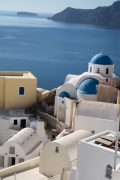 Santorini shapes and colors set against the blue of the caldera