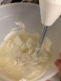 Mixing cream cheese with immersion blender