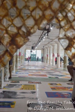 View through a broken window pane of the display of Lego portraits of political prisoners